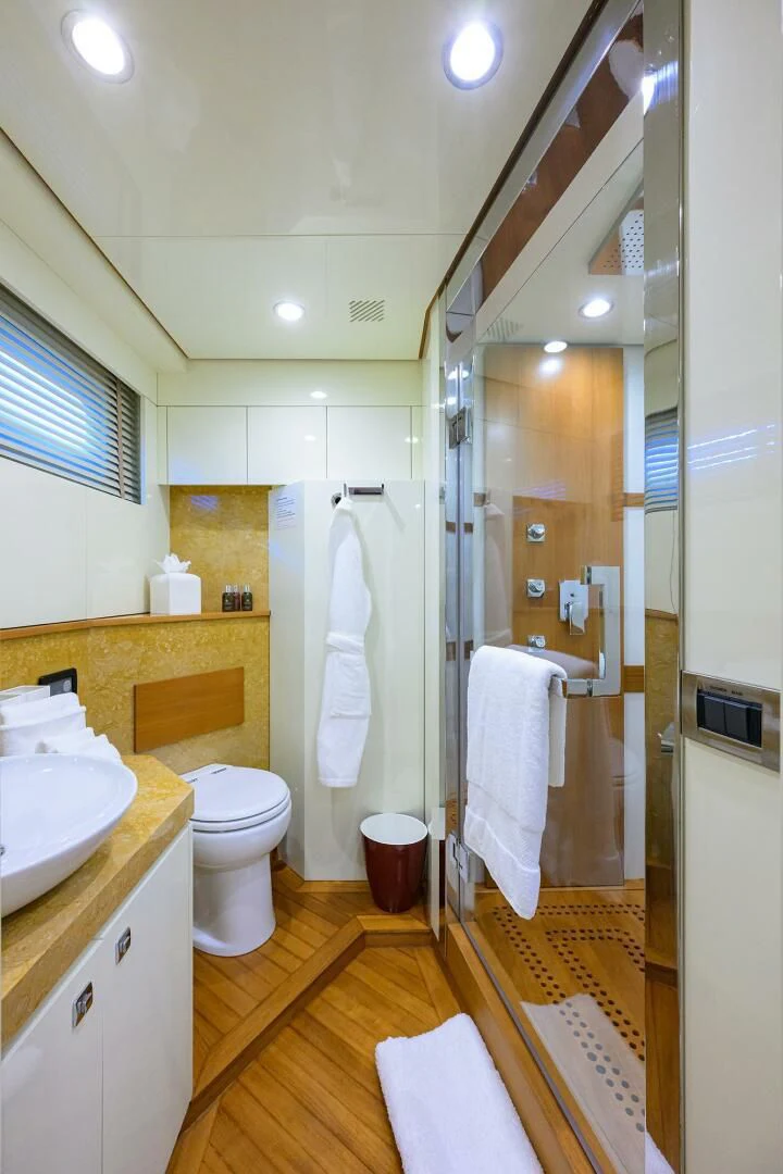 a bathroom with a shower and toilet aboard KIMBERLIE Yacht for Sale