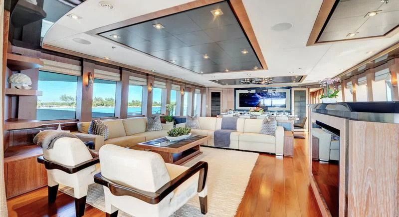 a living room with a large open window aboard STEALTH Yacht for Sale