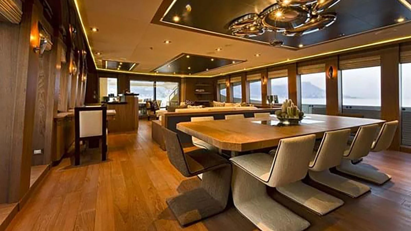 a room with a table chairs and a large window aboard STEALTH Yacht for Sale