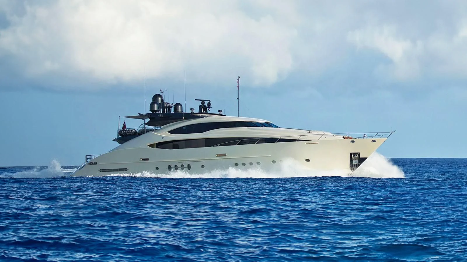 a white boat in the water aboard STEALTH Yacht for Sale