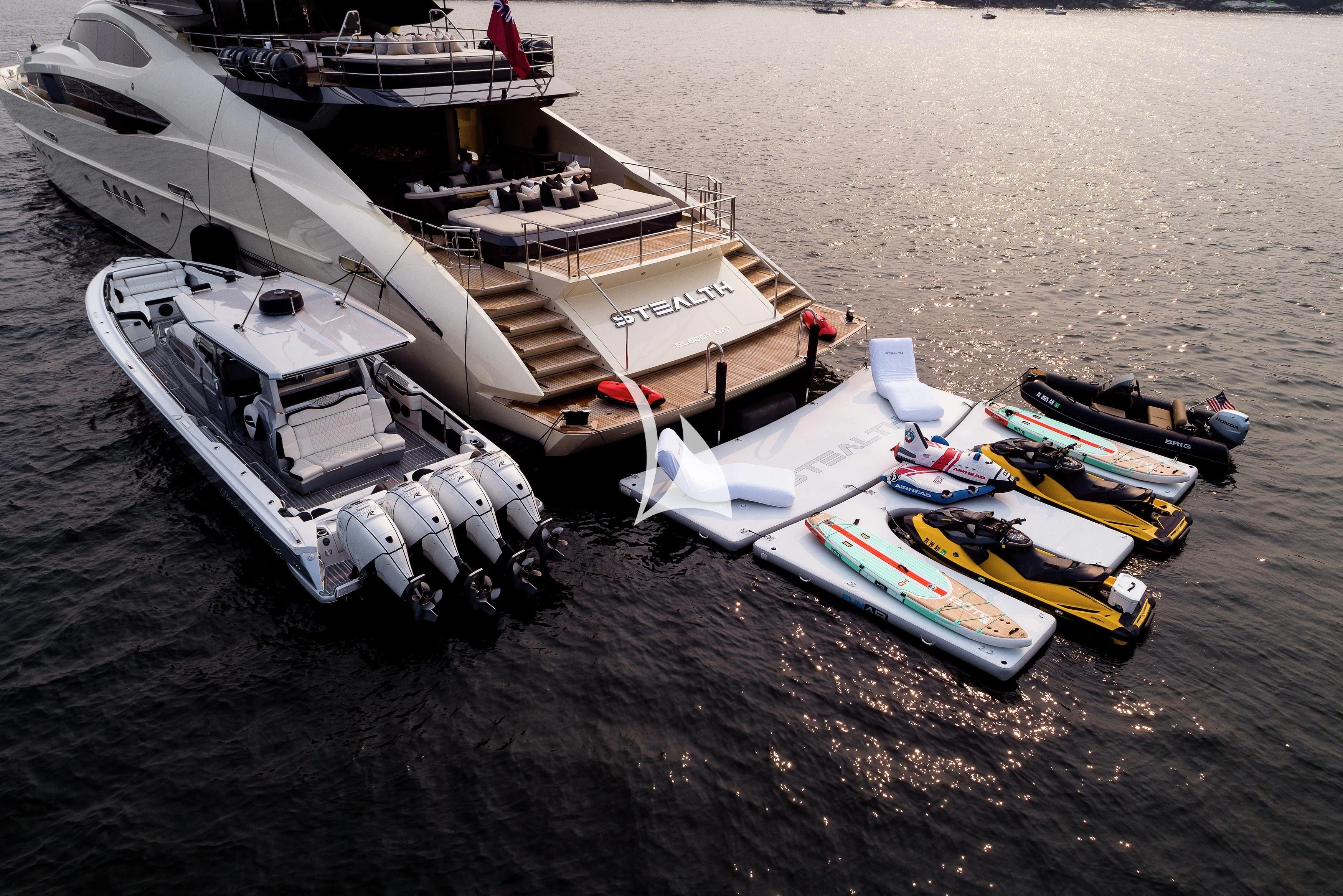 a boat and a boat on the water aboard STEALTH Yacht for Sale