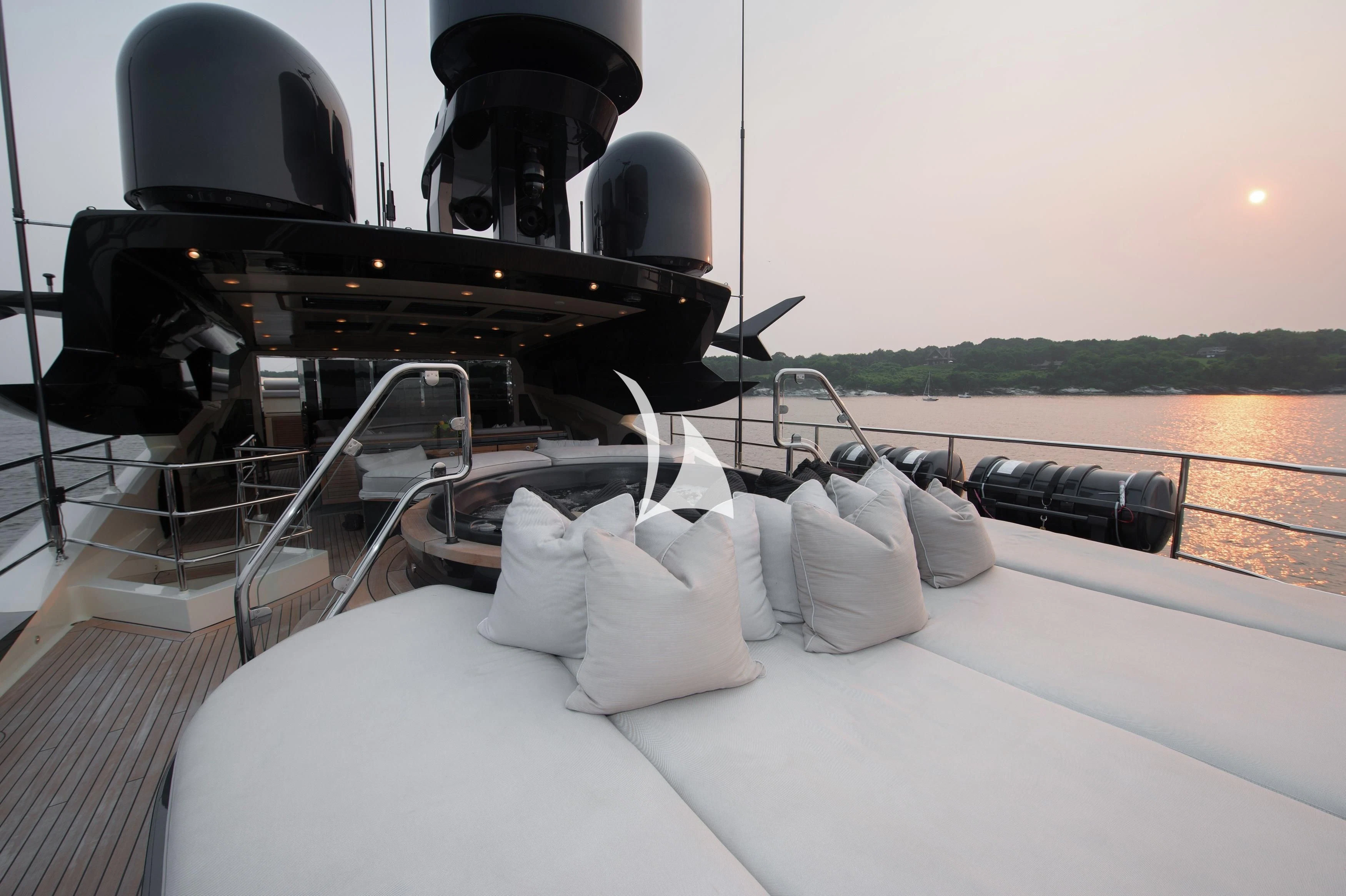 a bed with pillows on it aboard STEALTH Yacht for Sale