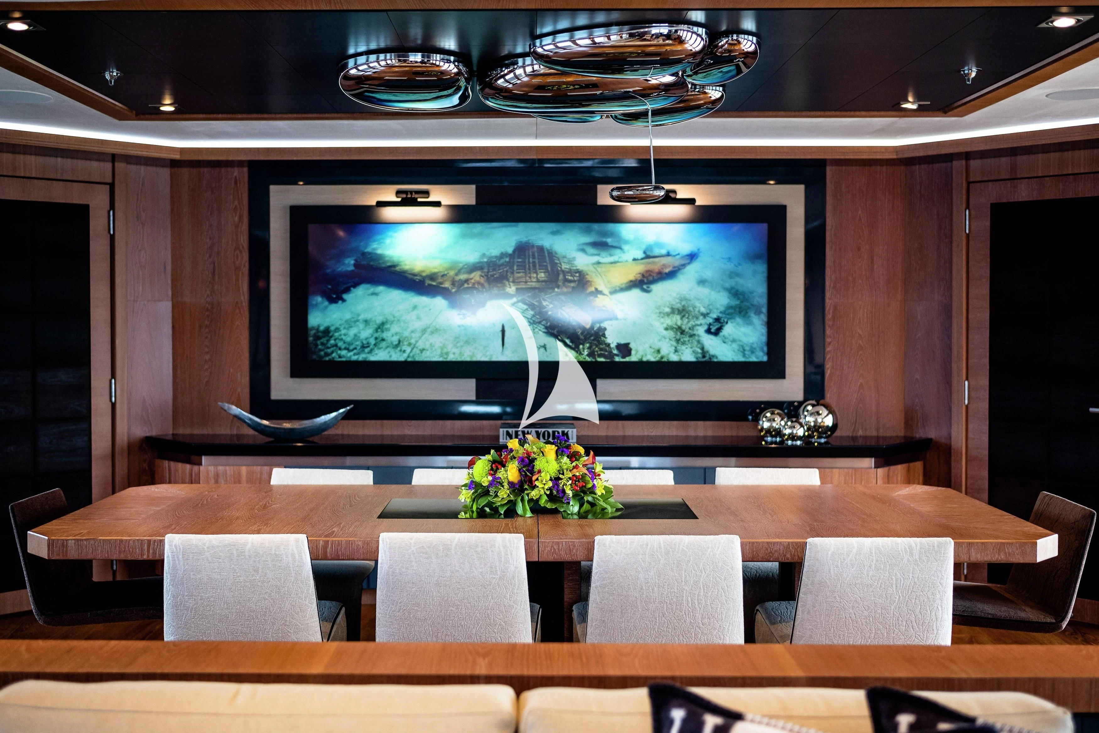 a large television in a room aboard STEALTH Yacht for Sale