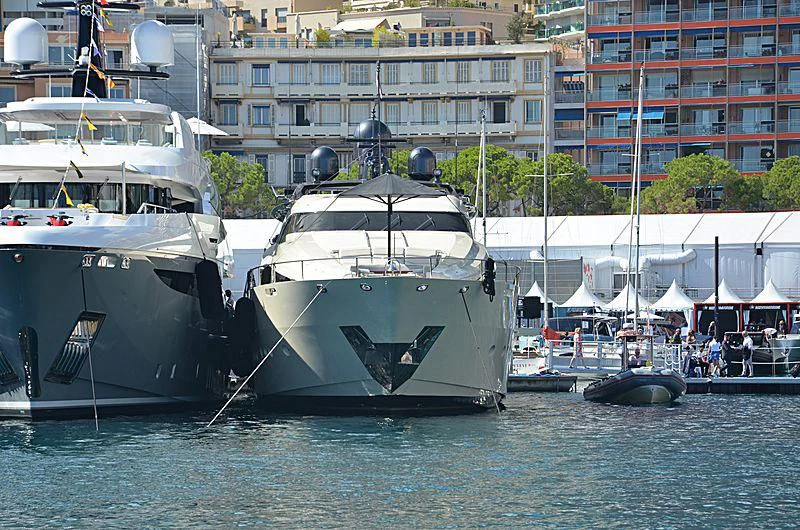 a group of boats are parked in a harbor aboard STEALTH Yacht for Sale