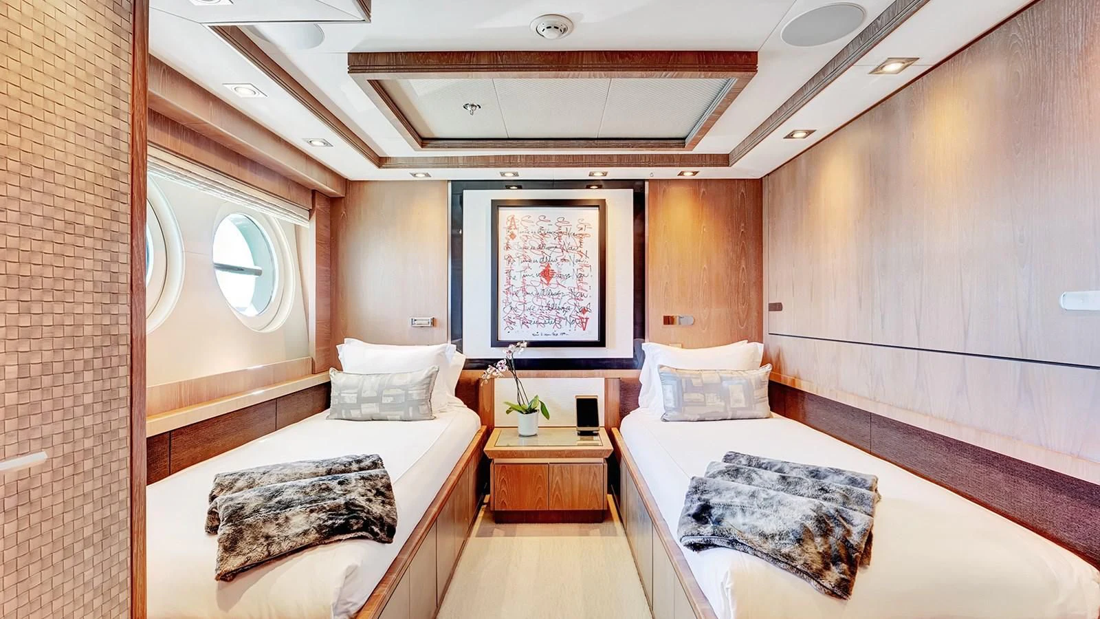 a room with two beds aboard STEALTH Yacht for Sale