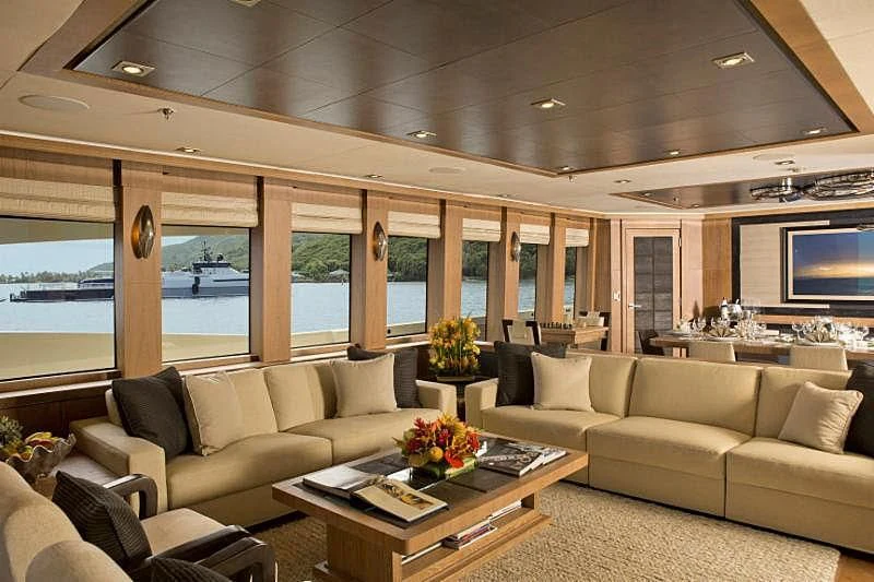 a living room with a large window aboard STEALTH Yacht for Sale