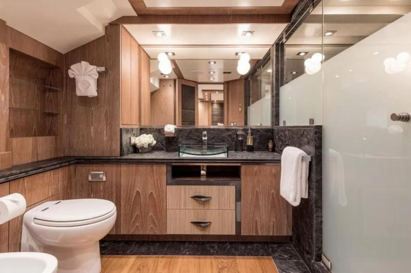 a bathroom with a large mirror aboard STEALTH Yacht for Sale