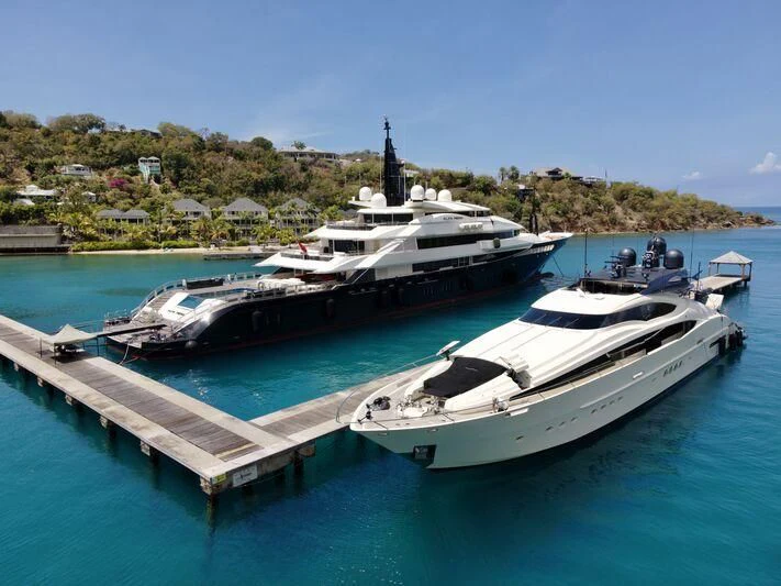 a couple of boats on a dock aboard STEALTH Yacht for Sale