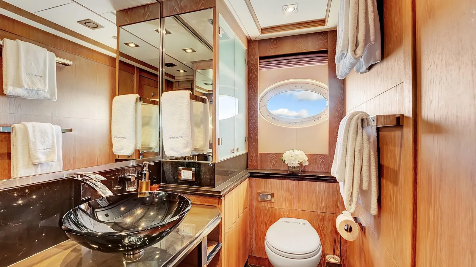 a bathroom with a sink and a mirror aboard STEALTH Yacht for Sale