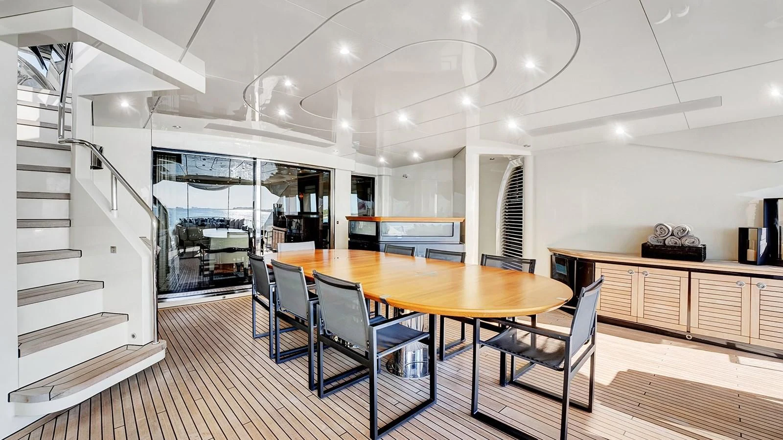 a large kitchen with a dining table aboard STEALTH Yacht for Sale