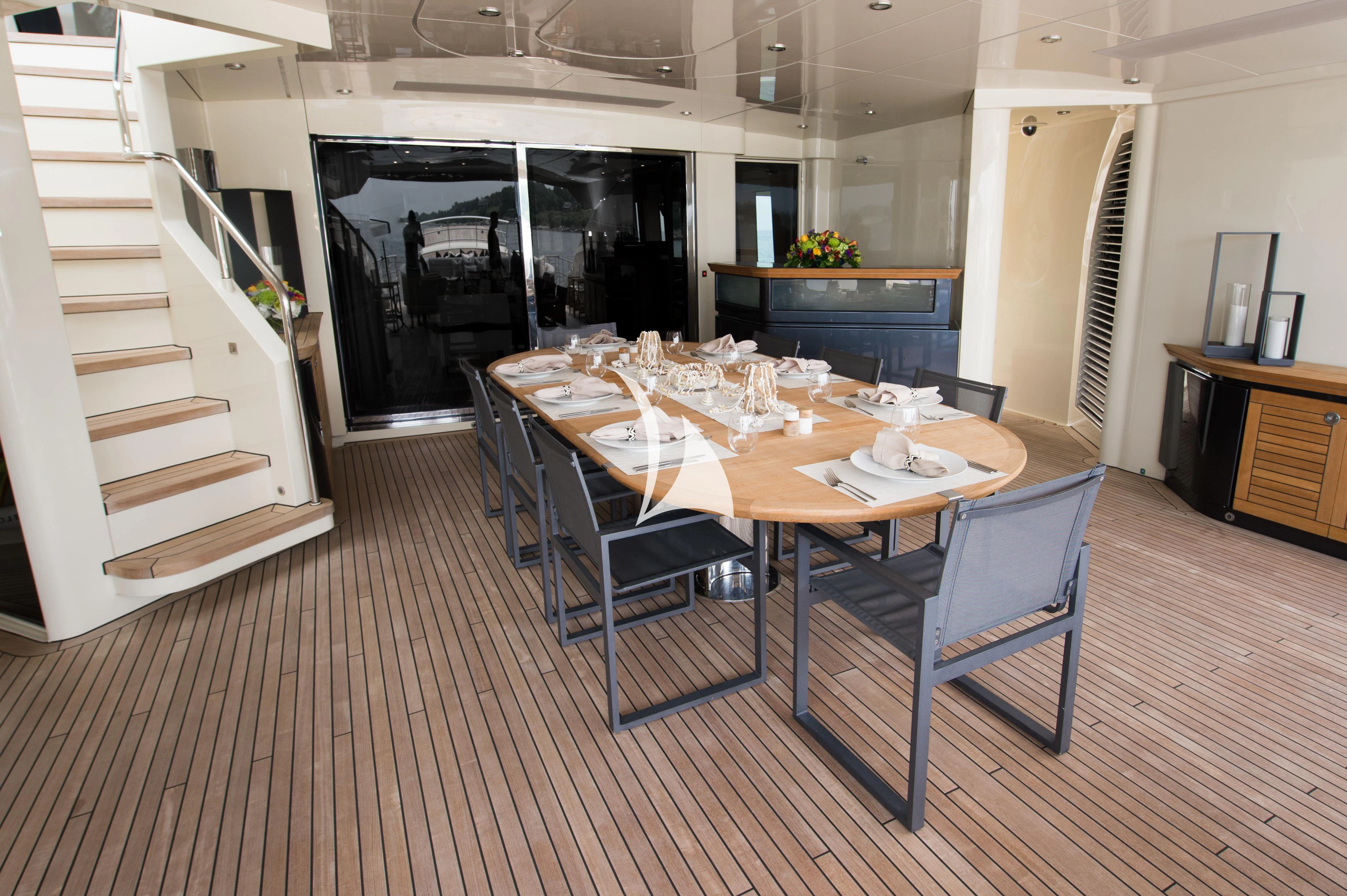 a dining table in a house aboard STEALTH Yacht for Sale
