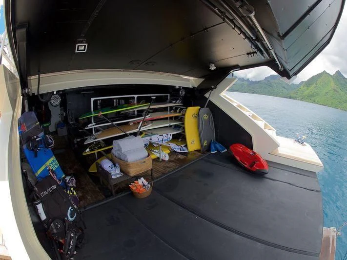 a boat with a large stack of boxes on it aboard STEALTH Yacht for Sale