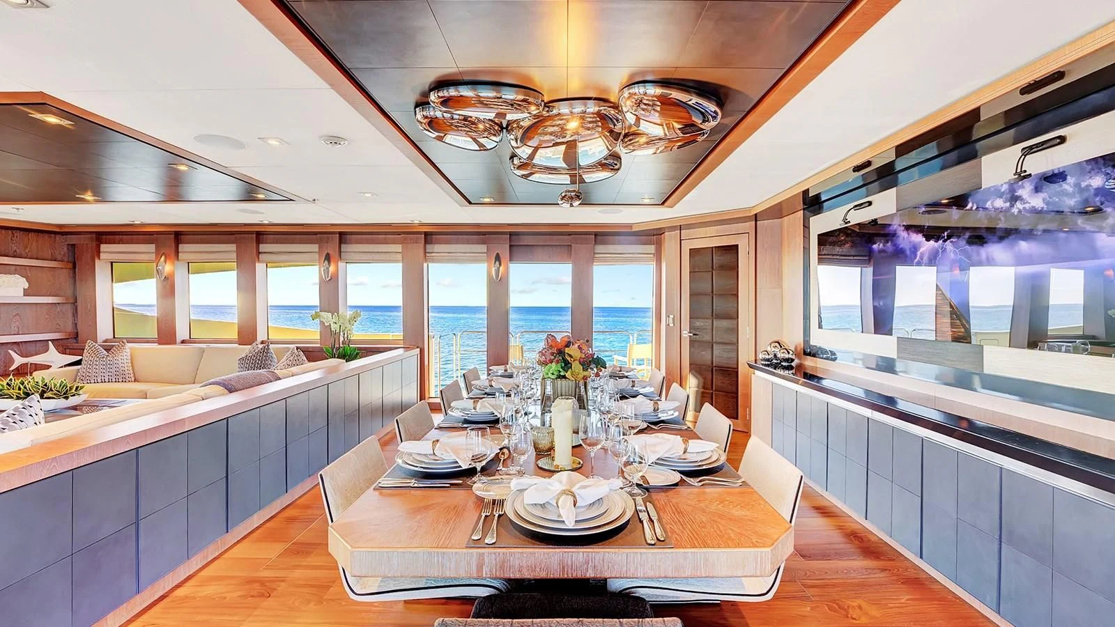 a large kitchen with a dining table aboard STEALTH Yacht for Sale