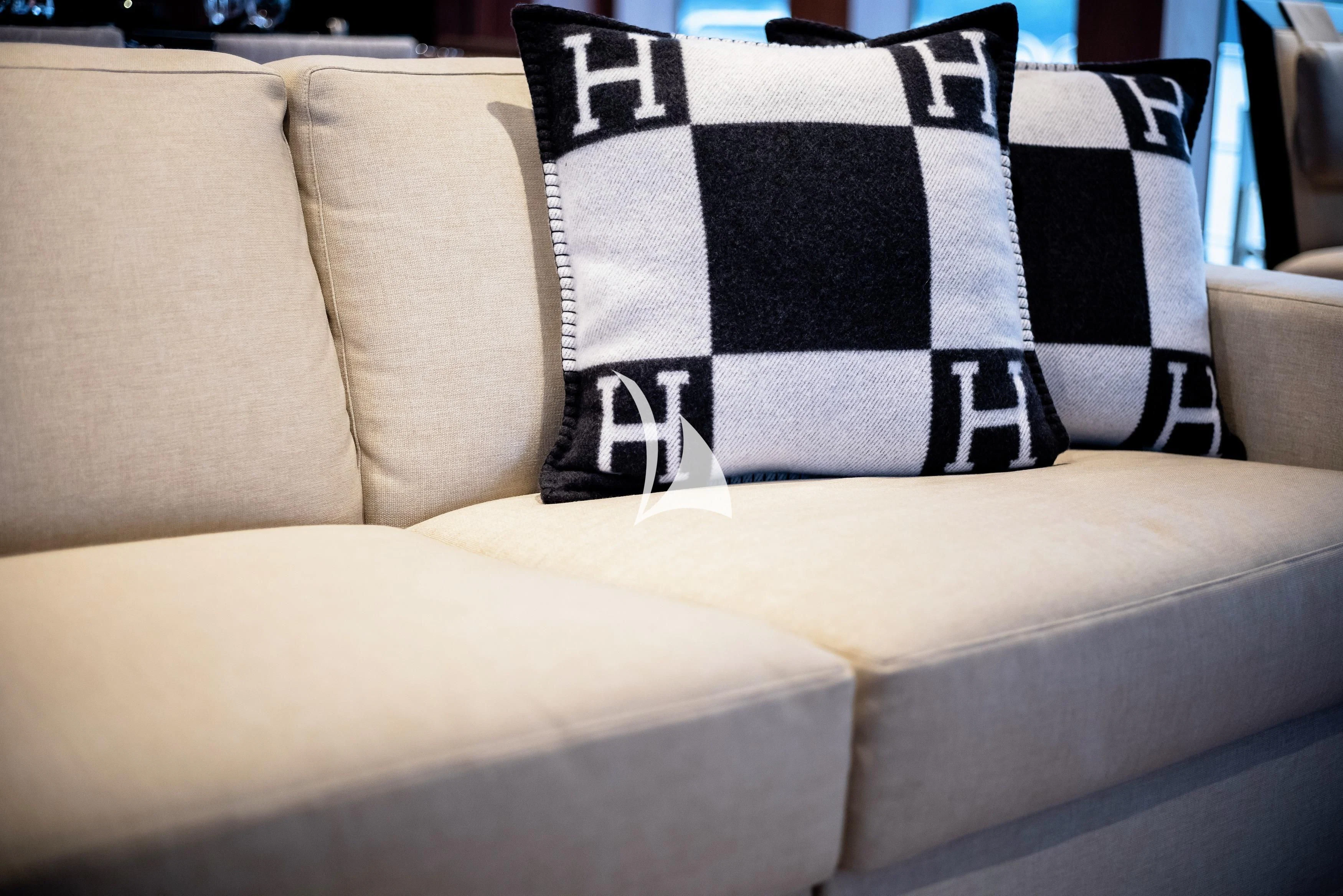 a couch with pillows aboard STEALTH Yacht for Sale