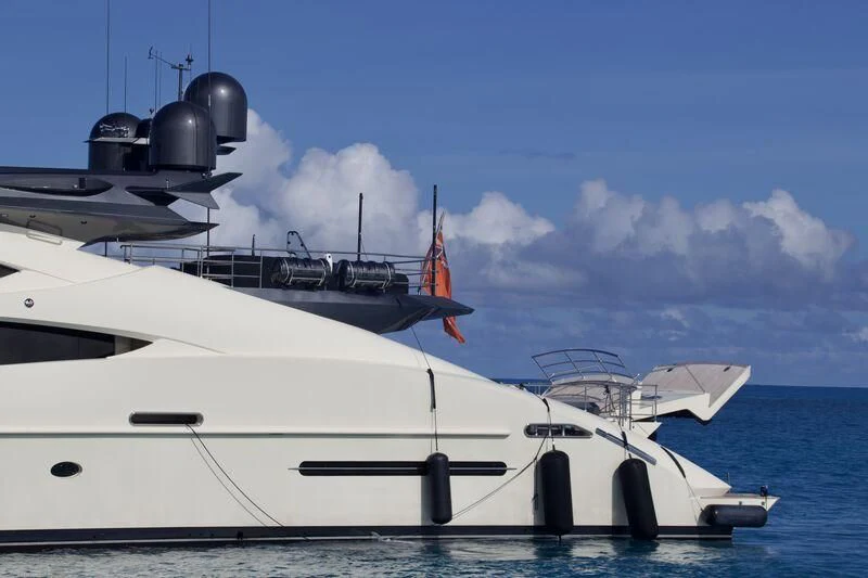a white yacht on the water aboard STEALTH Yacht for Sale