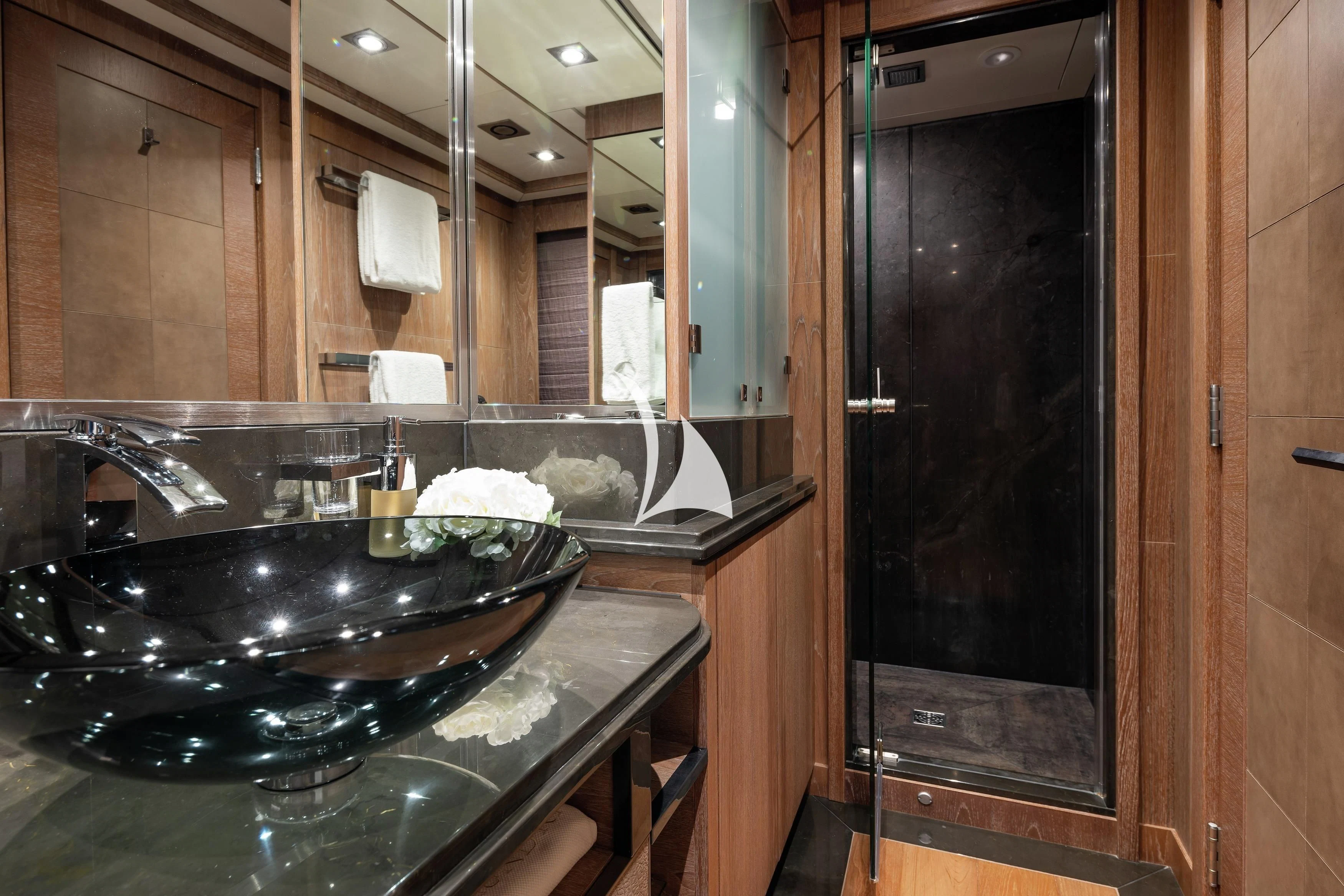 a bathroom with a sink and a mirror aboard STEALTH Yacht for Sale