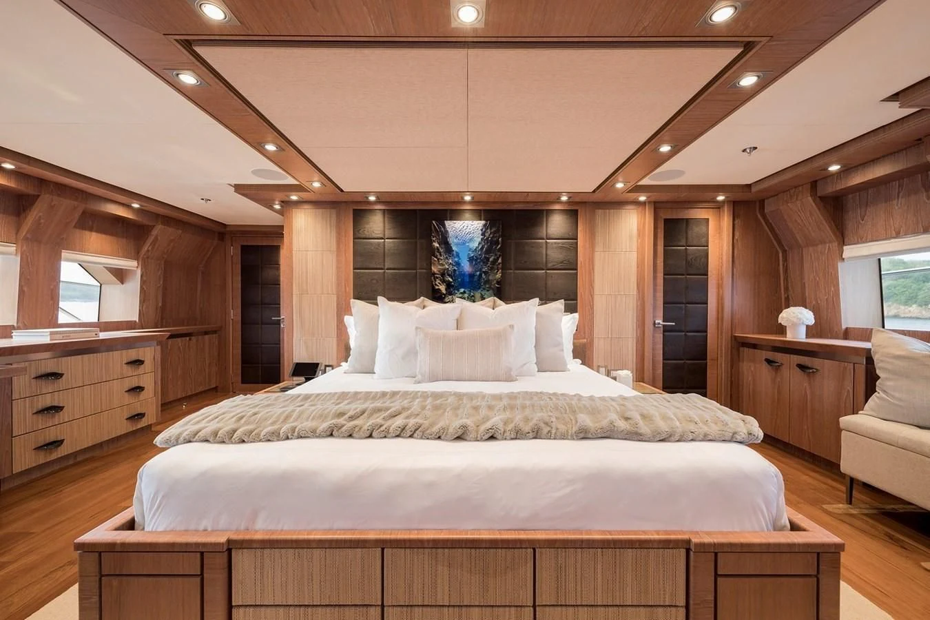 a large bed in a room aboard STEALTH Yacht for Sale