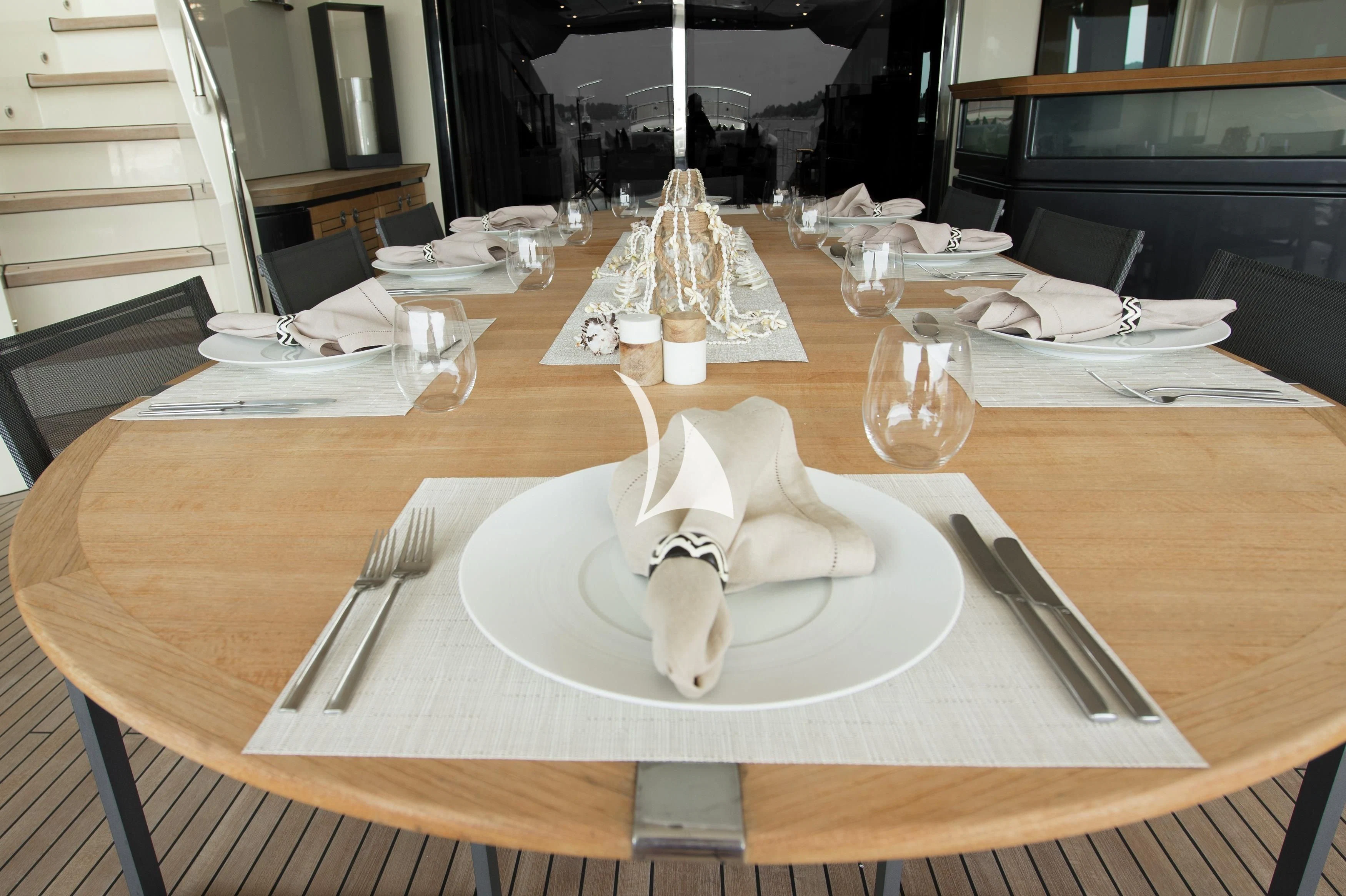 a table with plates and silverware aboard STEALTH Yacht for Sale