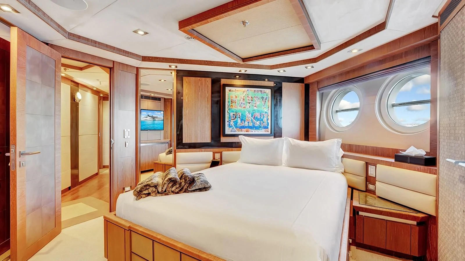a large bedroom with a large bed aboard STEALTH Yacht for Sale
