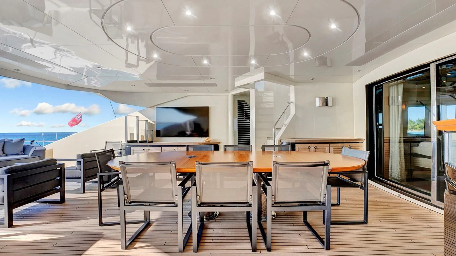 a room with tables and chairs aboard STEALTH Yacht for Sale