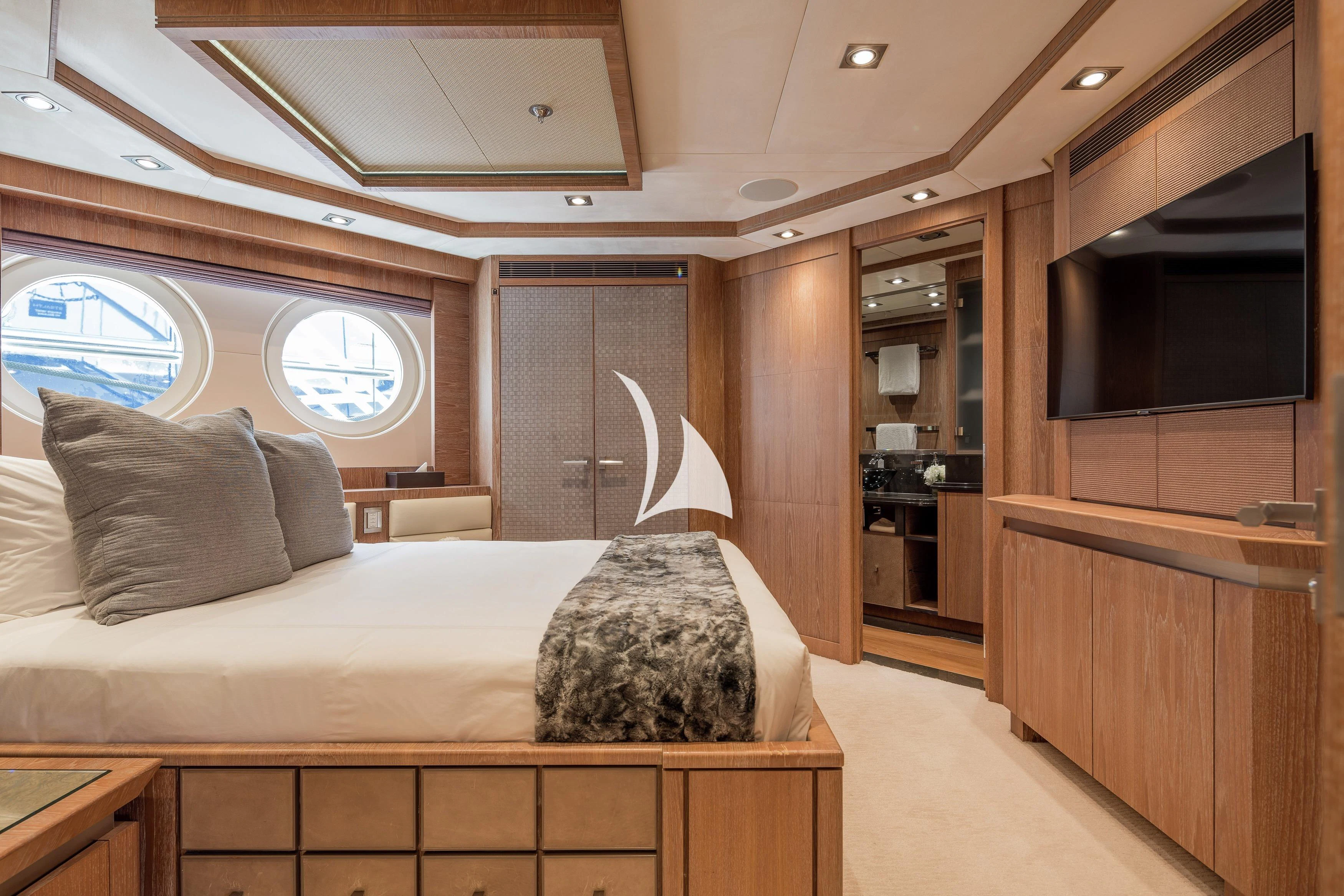 a bedroom with a bed and a window aboard STEALTH Yacht for Sale