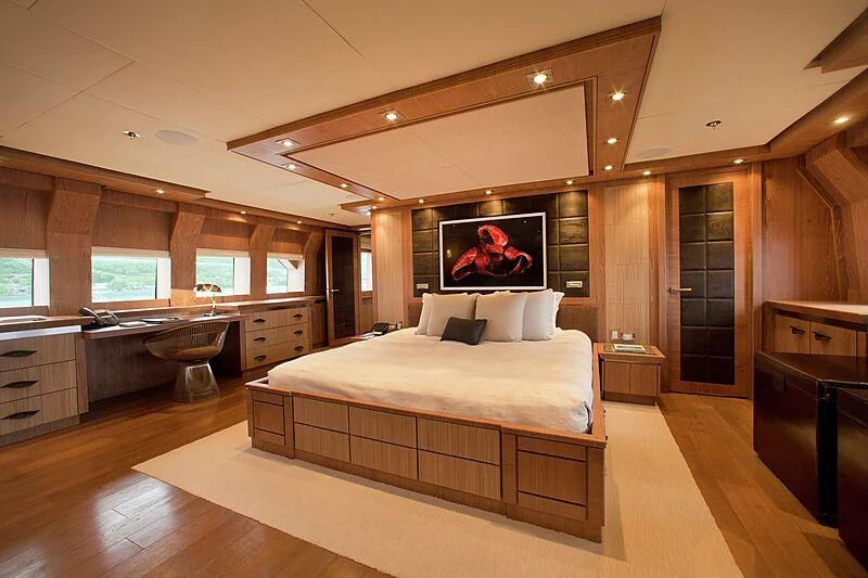 a large bedroom with a large bed aboard STEALTH Yacht for Sale
