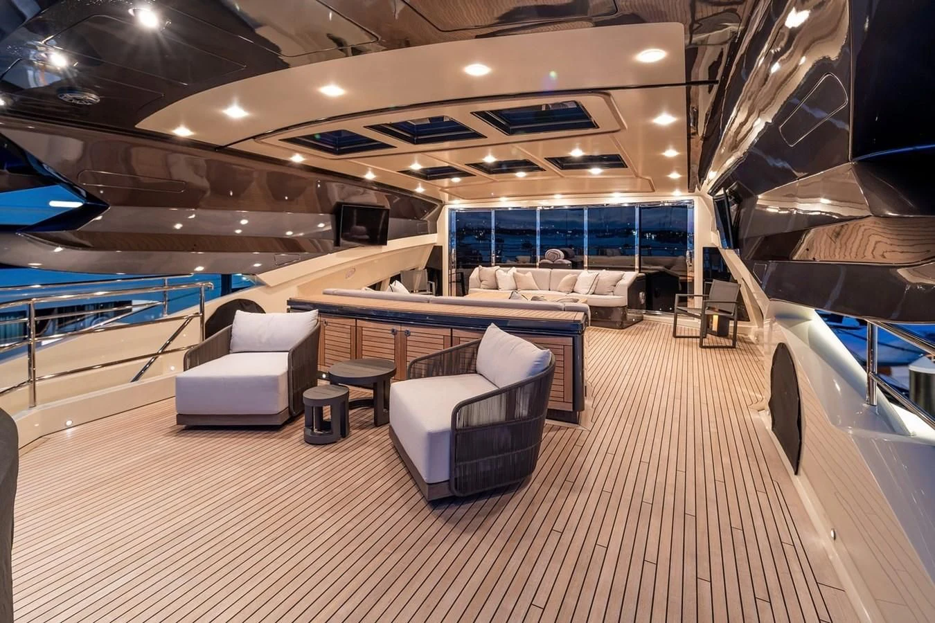 a room with a pool table and chairs aboard STEALTH Yacht for Sale