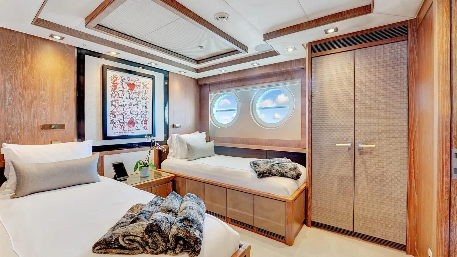 a room with a bed and a door aboard STEALTH Yacht for Sale