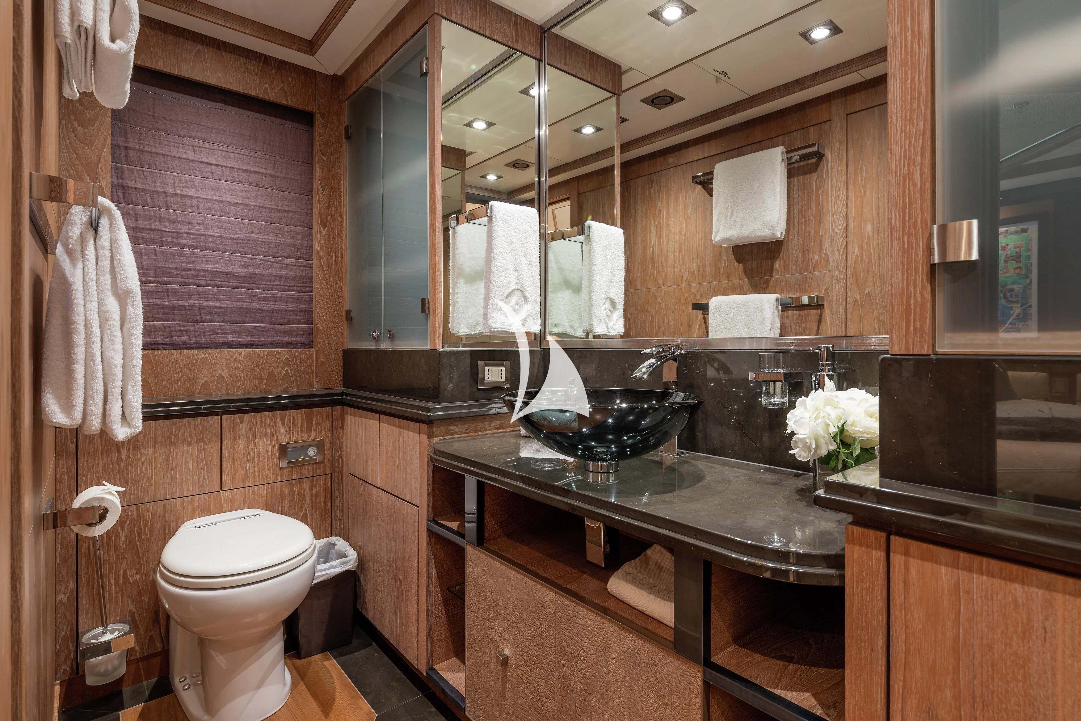 a bathroom with a large mirror aboard STEALTH Yacht for Sale