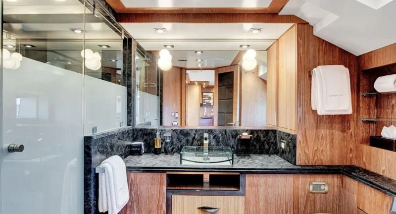 a bathroom with a large mirror aboard STEALTH Yacht for Sale