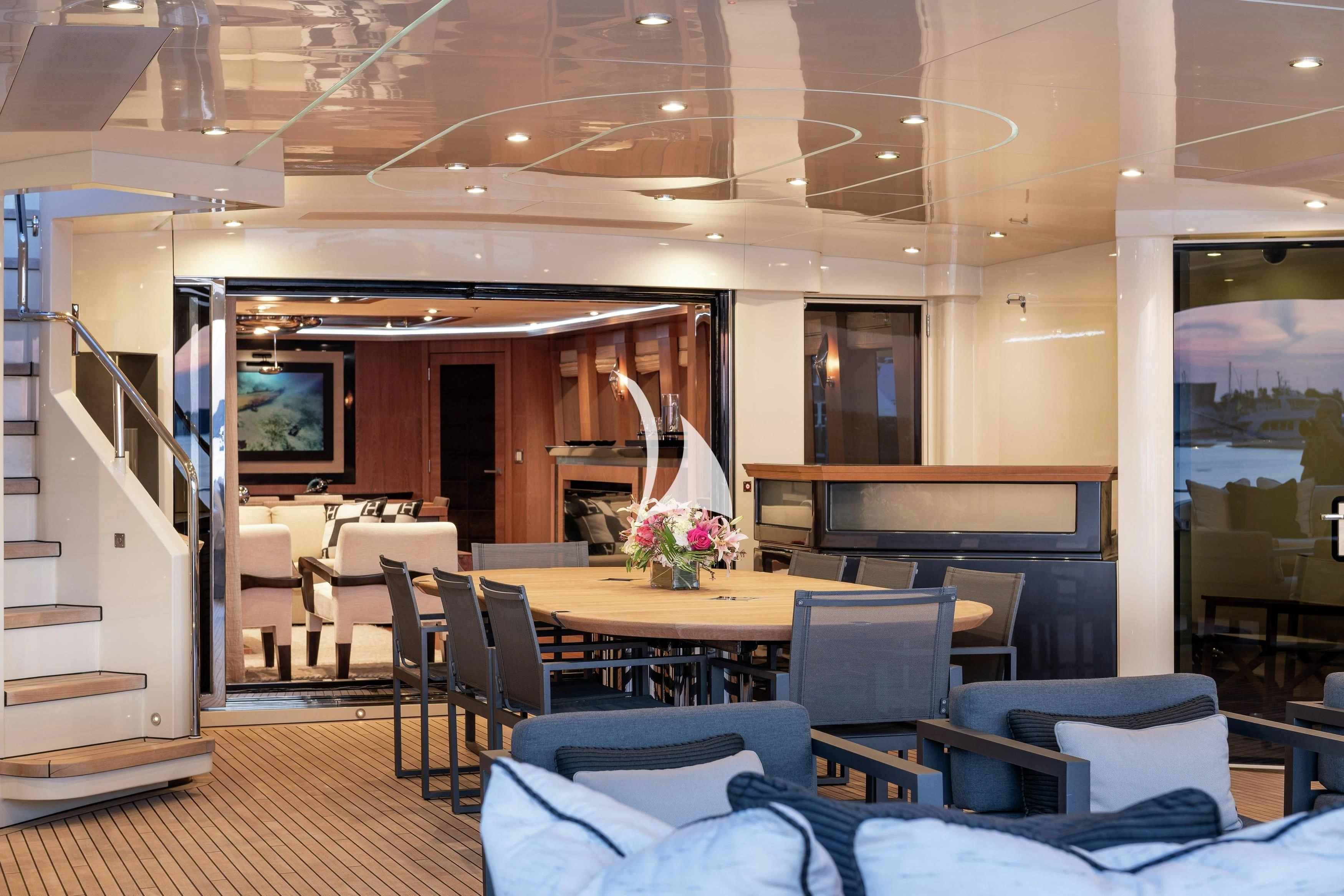 a room with chairs and tables aboard STEALTH Yacht for Sale