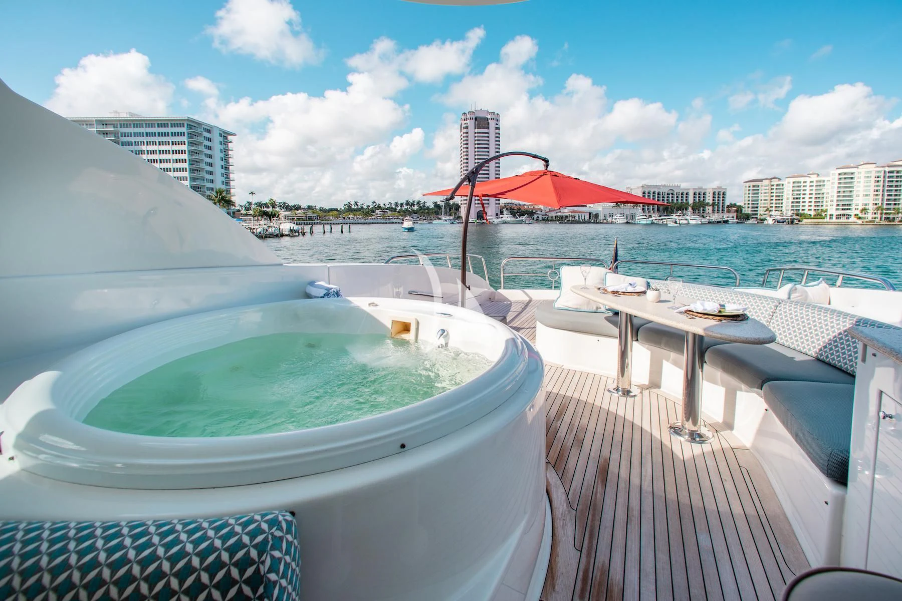 a deck with a pool and a city in the background aboard SUMMERWIND Yacht for Sale