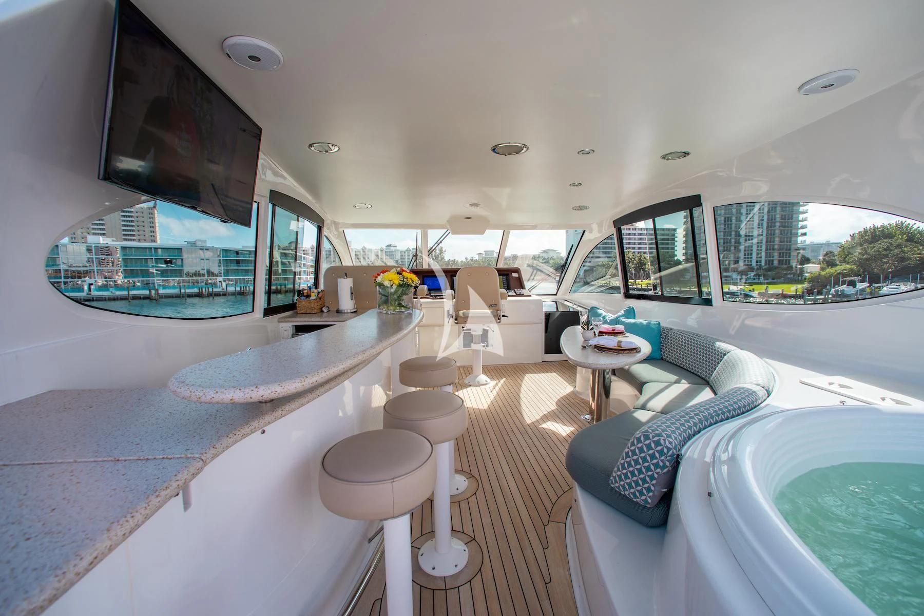 a large white room with a large window and a pool aboard SUMMERWIND Yacht for Sale
