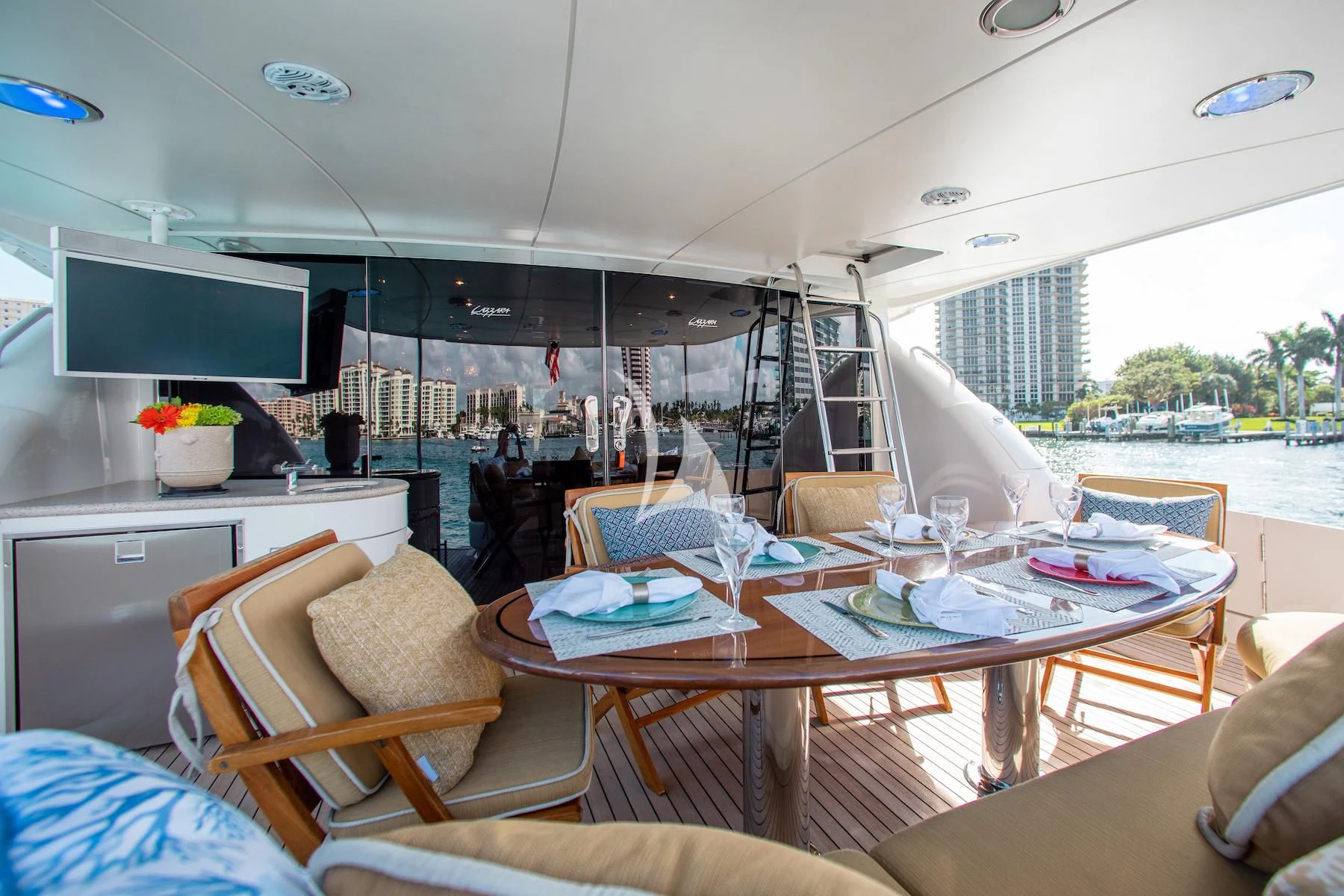a room with a table chairs and a tv aboard SUMMERWIND Yacht for Sale