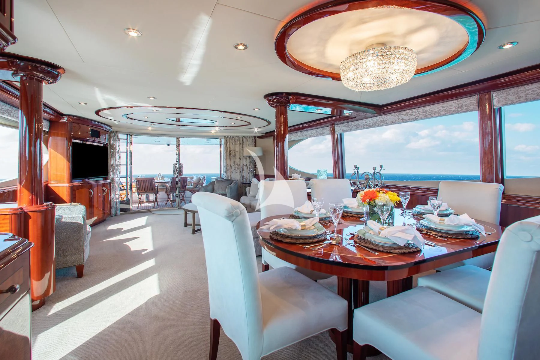 a room with a table and chairs aboard SUMMERWIND Yacht for Sale