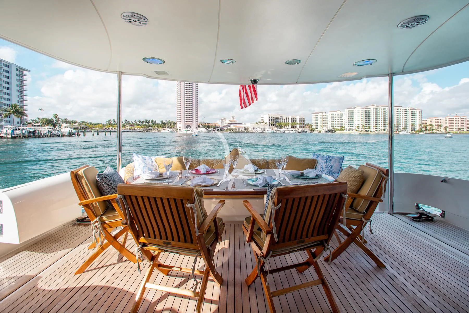 a table set for a meal on a deck overlooking a city aboard SUMMERWIND Yacht for Sale