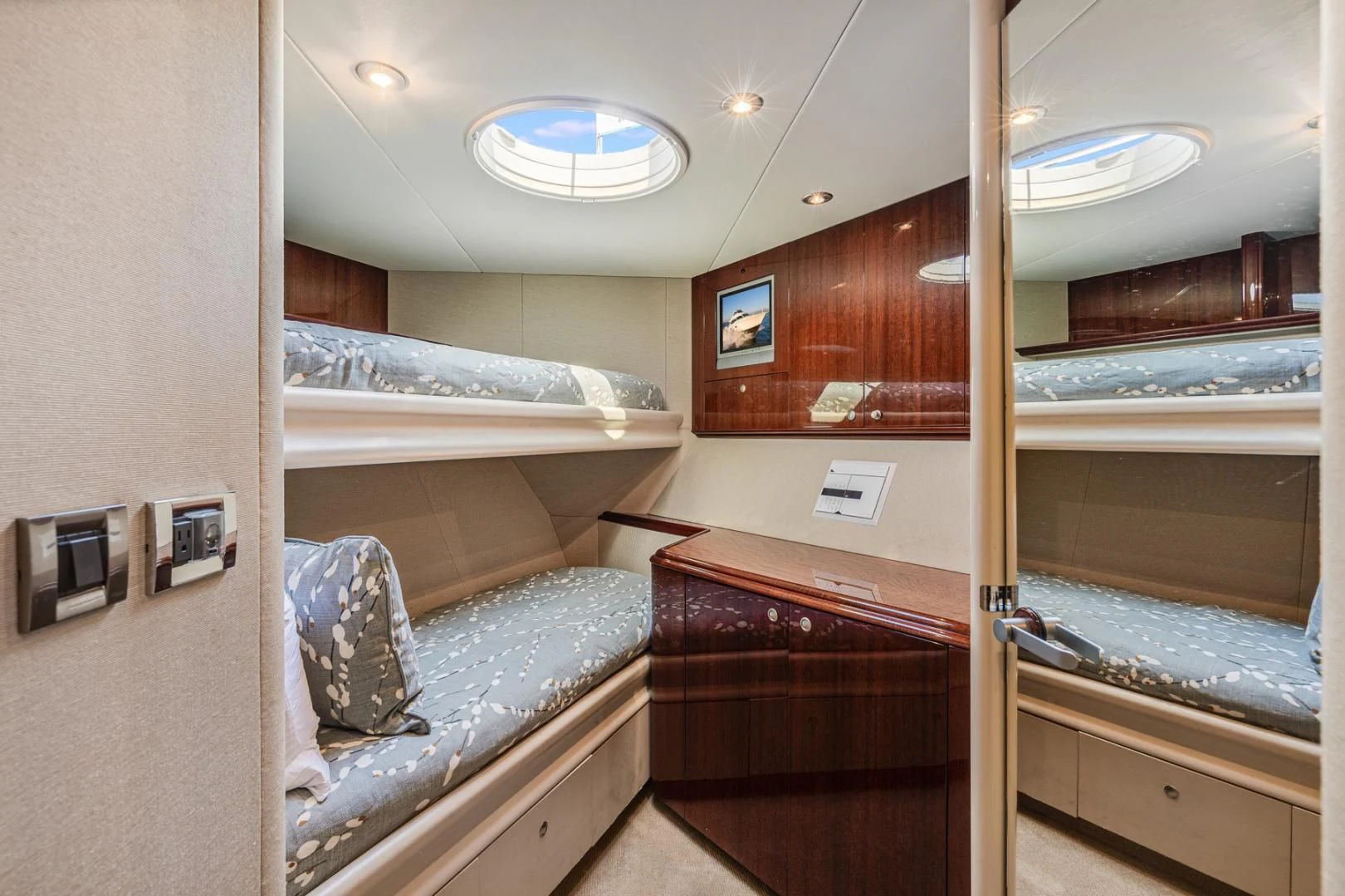 a room with a bed and a mirror aboard SUMMERWIND Yacht for Sale