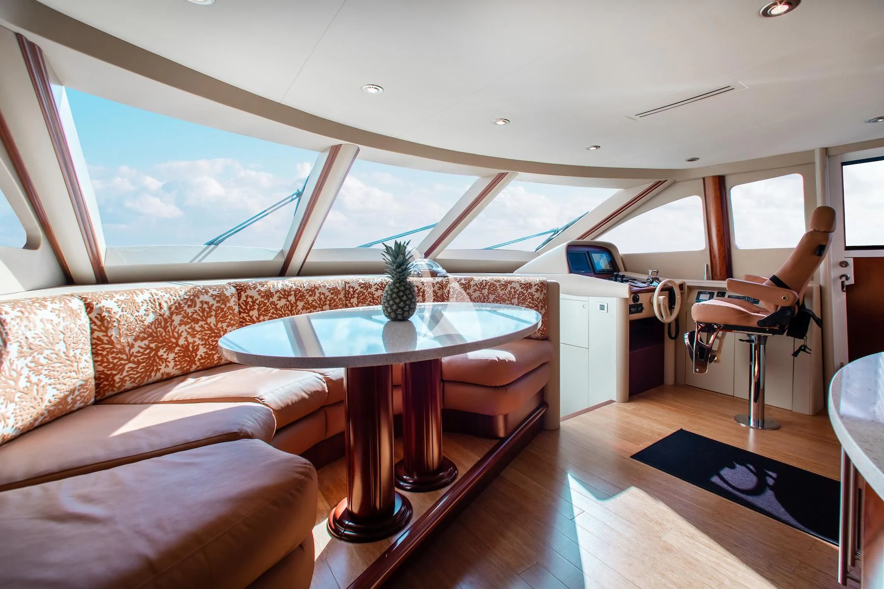 a room with a table and a couch aboard SUMMERWIND Yacht for Sale