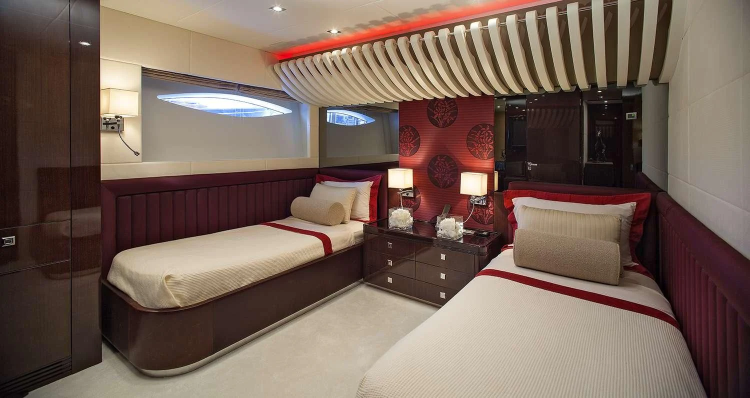 a room with two beds aboard MY TOY Yacht for Sale
