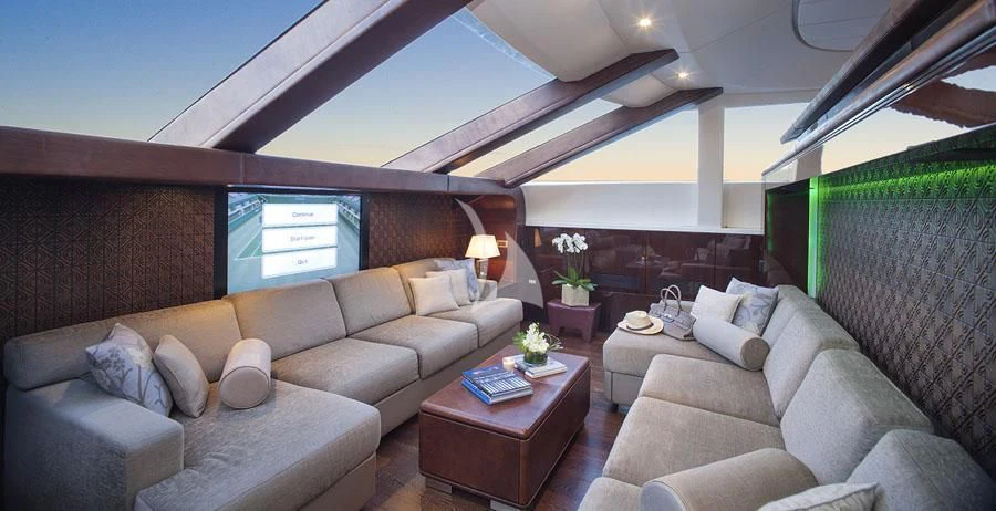 a living room with a couch and a table aboard MY TOY Yacht for Sale