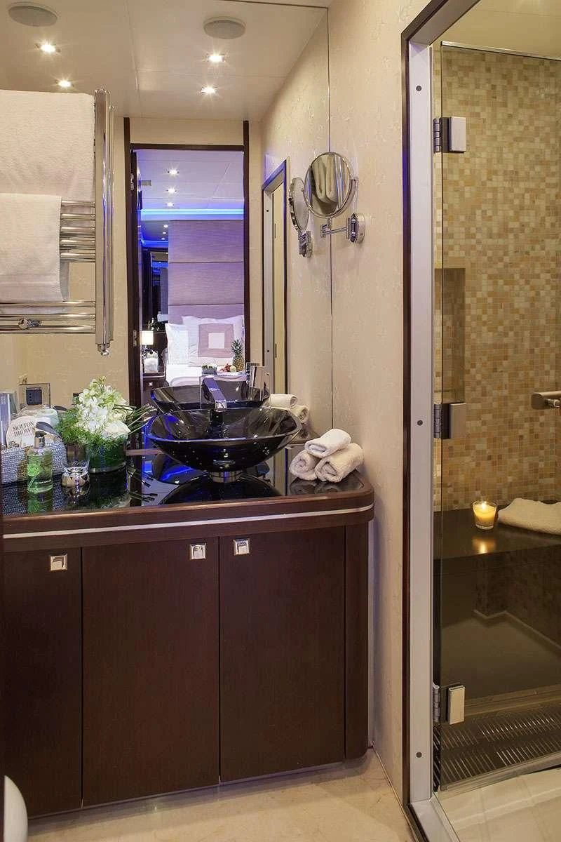 a bathroom with a sink and a mirror aboard MY TOY Yacht for Sale