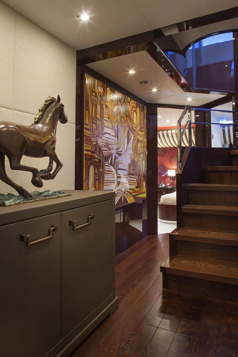 a statue of a lion on a counter in a room with a mirror aboard MY TOY Yacht for Sale