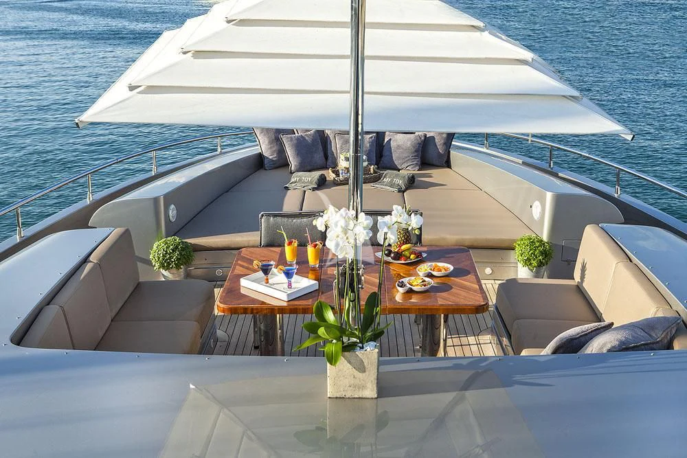 a table with food on it aboard MY TOY Yacht for Sale