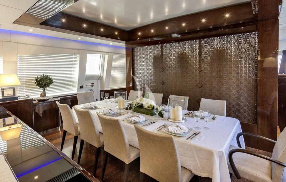 a dining room with tables and chairs aboard MY TOY Yacht for Sale