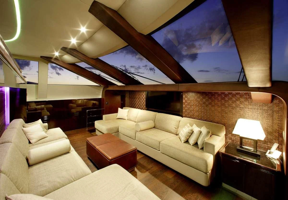 a living room with a large painting aboard MY TOY Yacht for Sale