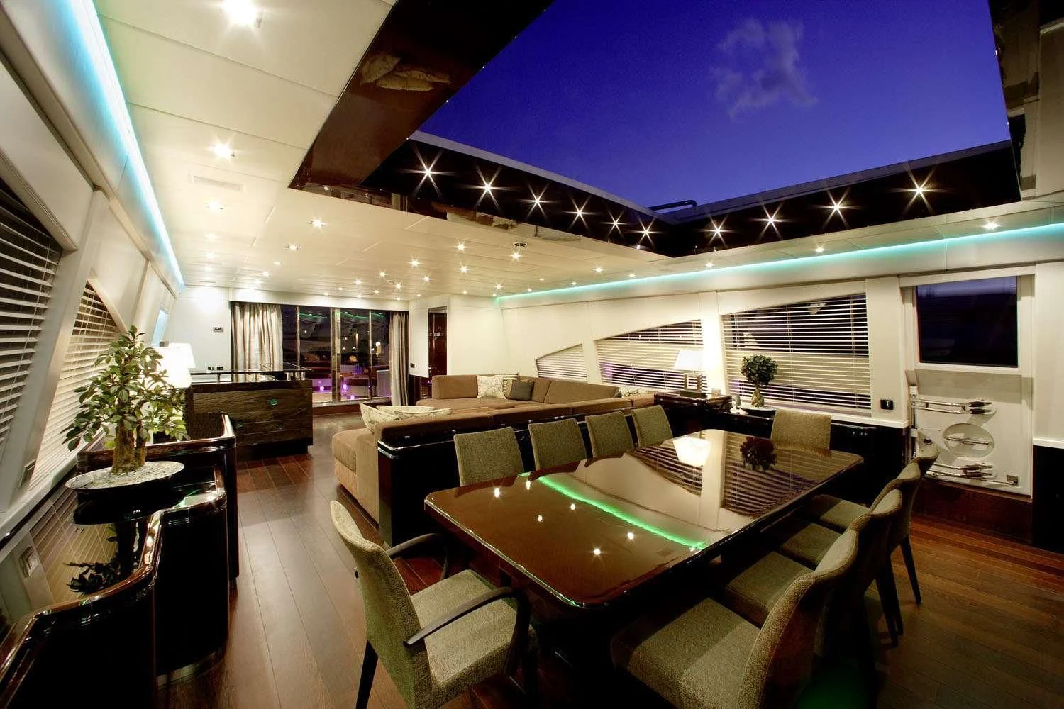a room with a table and chairs aboard MY TOY Yacht for Sale