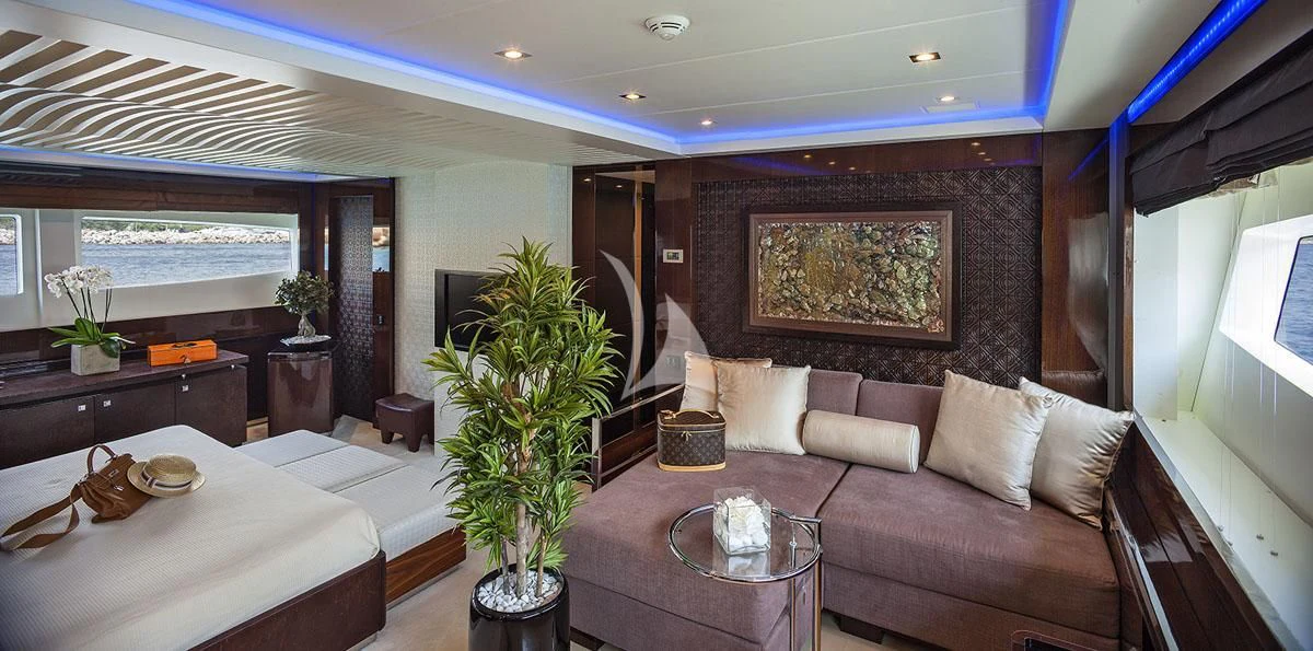 a living room with a couch and a table aboard MY TOY Yacht for Sale
