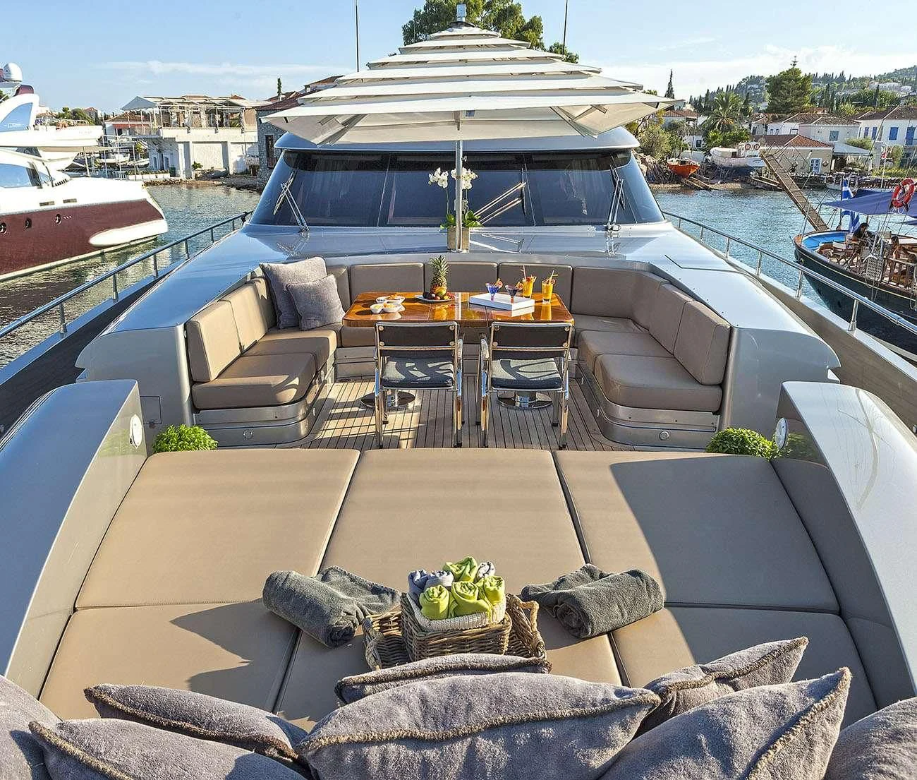 a patio with a table and chairs aboard MY TOY Yacht for Sale