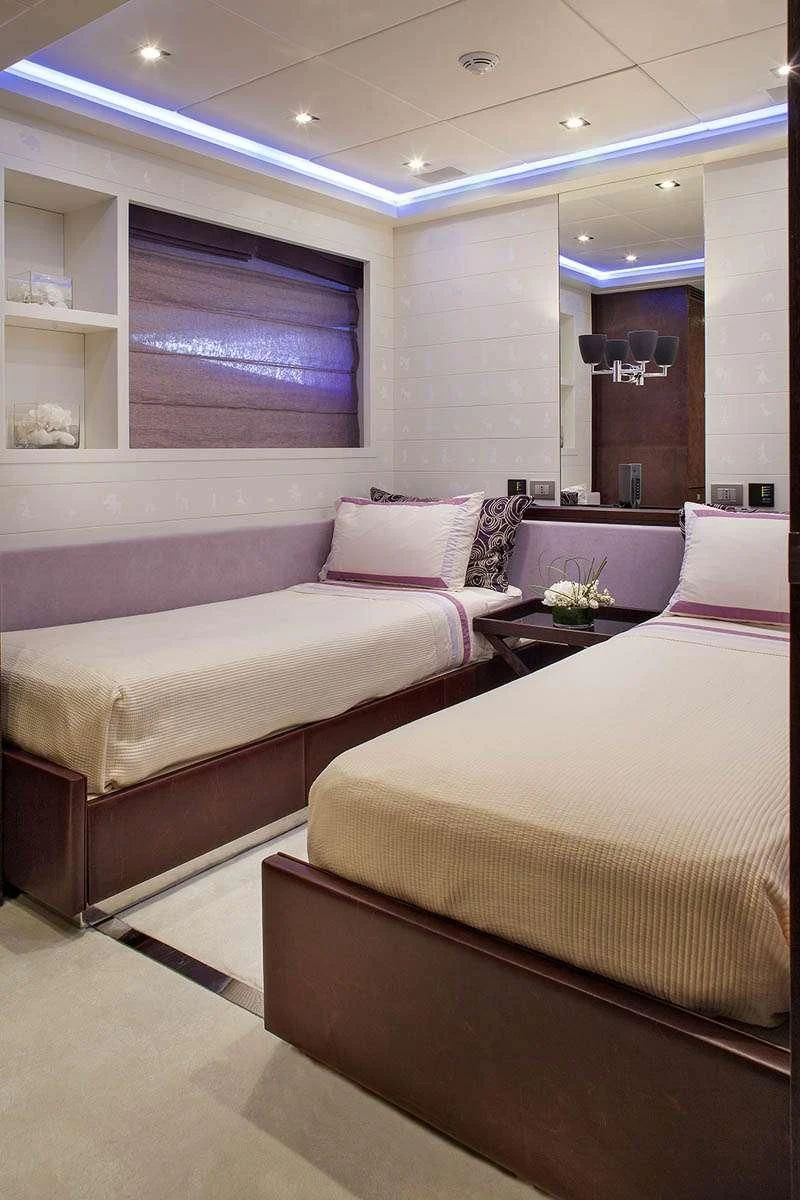 a room with two beds aboard MY TOY Yacht for Sale