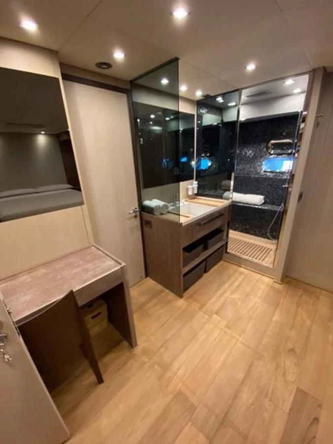 a bathroom with a large mirror aboard @LAST Yacht for Sale